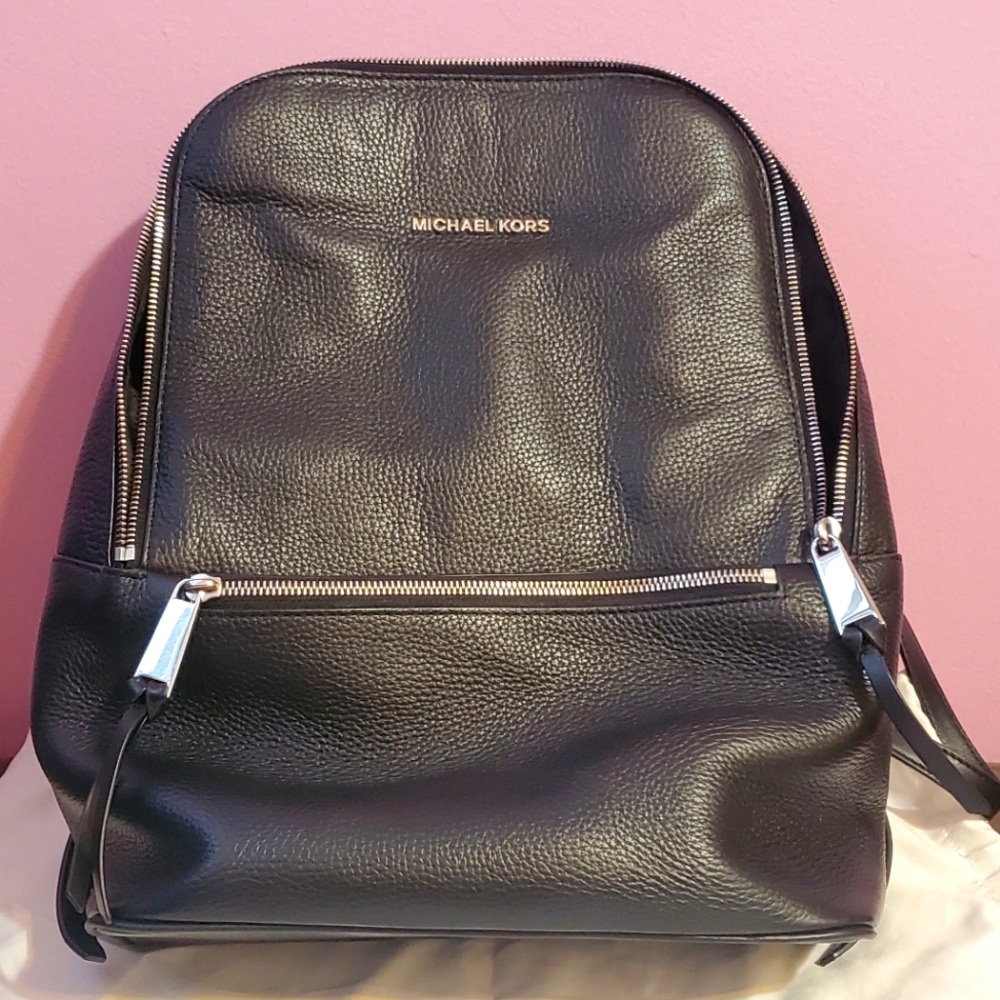 Michael Kors black leather backpack.